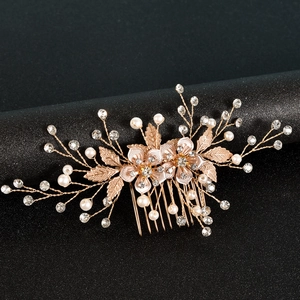 Exquisite bridal hair comb with pearls and rhinestones on rose gold flower and leaf design