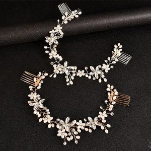 Handmade bridal hair accessories set with pearls and crystal flowers in gold and silver finish