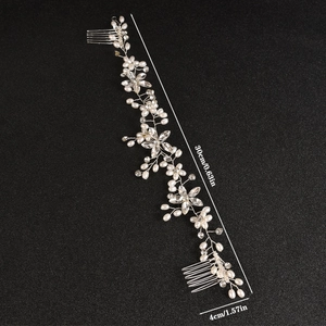 Detail of bridal hair vine with white pearls and marquise rhinestones on silver wire