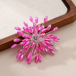 Macro detail of handmade crystal flower hair clip with pink beads and purple gemstone