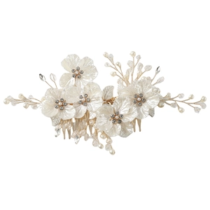 White shell flower bridal hair comb with pearls and crystals on a gold metal base