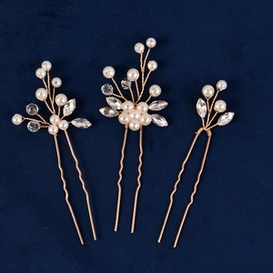 Three-piece bridal pearl hair pin set with gold wire and rhinestones on blue velvet