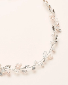 Macro view of handmade bridal hair vine with pearls and crystals on silver wire