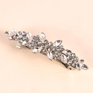 Close-up of alloy petal hair clip with marquise rhinestones and silver metal base