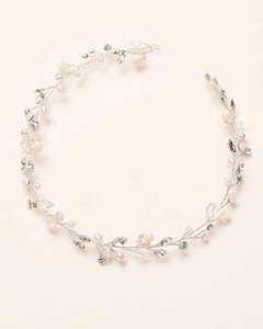 Detailed close-up of handmade bridal headband with silver wire, pearls and crystals