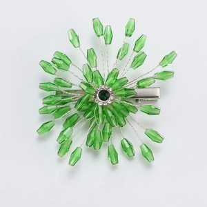 Handmade green crystal flower bridal hair clip with emerald gemstone and silver rhinestones