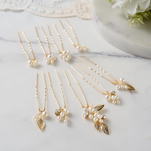 Detail of 9-piece gold leaf and pearl bridal hair pin set for elegant wedding styling