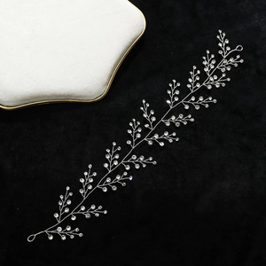 Handmade silver bridal hair vine with sparkling crystals and rhinestones for wedding styling