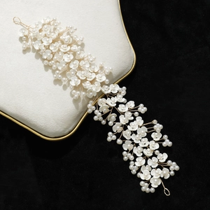 Elegant bridal hair vine with white flowers and pearls on golden wire accessory