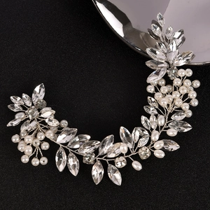 Elegant bridal hair vine with shimmering rhinestones and pearls on a silver-tone wire band