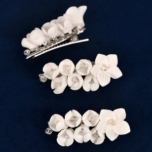 Three-piece bridal lily of the valley hair clips with white ceramic flowers and crystals