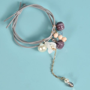 Élastique à cheveux fait main avec fleur de muguet et perles de couleur violette