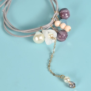 Élastique à cheveux fait main avec perles, fleur de muguet et perles de citrouille