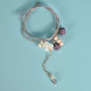 Élastique à cheveux fait main avec muguet et perles sur plusieurs bandes grises