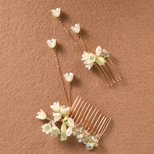 Handmade lily of the valley hair comb set with white flower petals and gold tassels