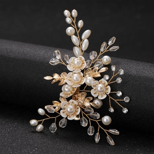 Elegant white floral bridal hair clip with gold leaves, pearls and crystal beads