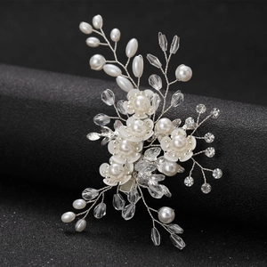 Elegant white flower bridal hair clip with silver wire, pearls and crystals on black stand
