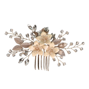 Handmade bridal hair comb with rose gold leaves, cream flowers, and crystal accents