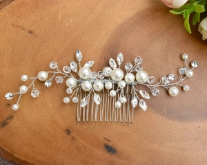 Detailed view of handmade pearl and crystal bridal hair comb with silver wire weaving