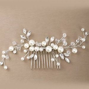 Elegant bridal hair comb with white pearls and crystals in a botanical vine design
