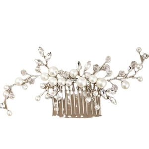 Elegant bridal hair comb with white pearls and sparkling crystals in flower leaf design