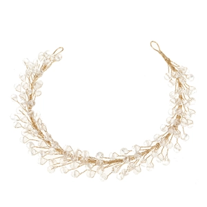 Detailed close-up of handmade bridal headband with gold wires and clear crystal beads
