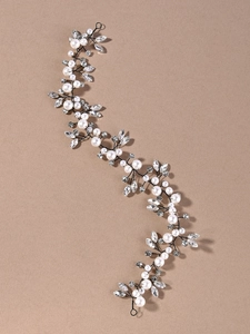Detailed macro of wedding hair vine featuring pearls and marquise cut glass crystals
