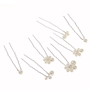 Detail view of 7-piece bridal hair pin set with white pearls and silver metal wire