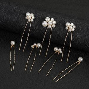 Set of 7 gold bridal hair pins with lustrous white pearls for wedding hair styling