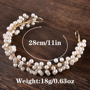Detailed view of bridal pearl hairpiece with golden wire, size 28cm and weight 18g