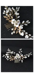 Close-up of handmade bridal hair comb with pearls, white flowers and crystals
