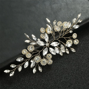 Exquisite silver bridal hair comb with marquise crystals and leaves on dark background