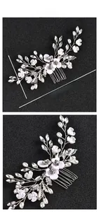 Detail of handmade bridal hair comb with pearls, white resin flowers, and crystals