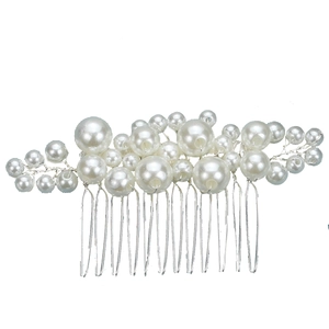 Elegant bridal hair comb with white pearls and silver metal teeth on white background