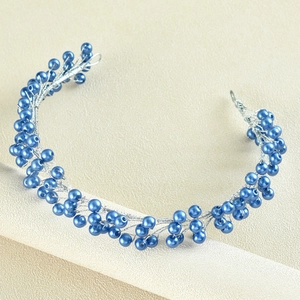 Detailed close-up of blue beaded wedding headband with hand-woven silver wire