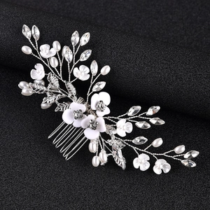 Handmade bridal hair comb with white flowers, pearls, and crystals on silver wire