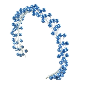 Detailed macro view of blue faux pearl bridal hair vine with silver woven wire