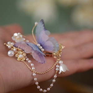 Ancient style butterfly hair clip with lavender silk wings and dangling pearl lily pendant
