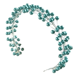 Detailed view of handmade bridal hairband featuring teal pearls and silver metal wires