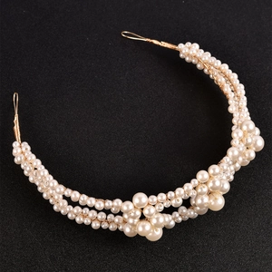 Elegant pearl bridal headband with white round pearls on gold woven wire structure