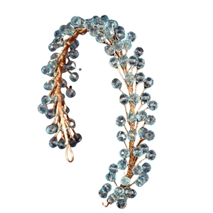 Detail of handmade gold wire hairband with sky blue faceted crystal beads and pearls