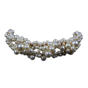 Elegant bridal headband featuring vintage white pearls on a gold metal base for weddings