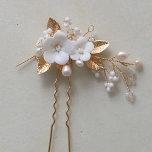 Handmade bridal U-shaped hair pin with white ceramic flowers and golden leaves