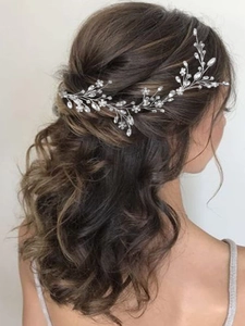 Detail of silver floral bridal hair vine with crystals and beads on brunette hair