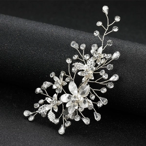 Silver bridal hair clip with sparkling crystal leaf and flower patterns on black base