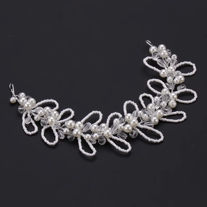 Handmade bridal hair vine with white pearls and clear crystals on a silver wire base