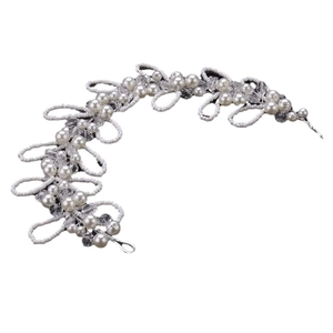 Elegant bridal hair band with white pearls and crystal beads on a clean white background