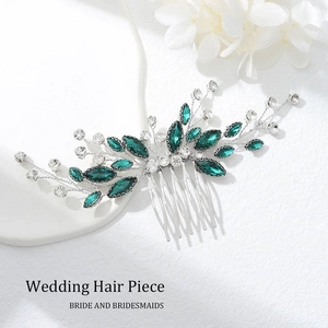 Detailed view of silver bridal hair comb with emerald crystals and clear rhinestones