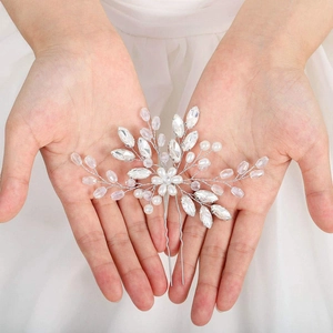 Handmade bridal hair pin with crystal beads and silver floral design for weddings