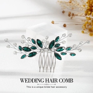 Detail of silver bridal hair comb with deep green marquise crystals and clear rhinestones